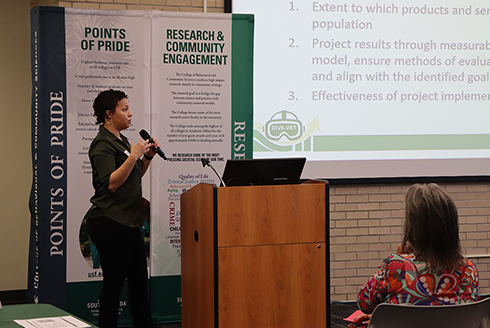 christine hugh at podium